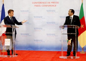France's President Emmanuel Macron (L) and Cameroon's President Paul Biya give a press conference in Yaounde, on July 26, 2022. Macron in on a three-day African tour in Cameroon, Benin and Guinea-Bissau. (Photo by Ludovic MARIN / AFP)